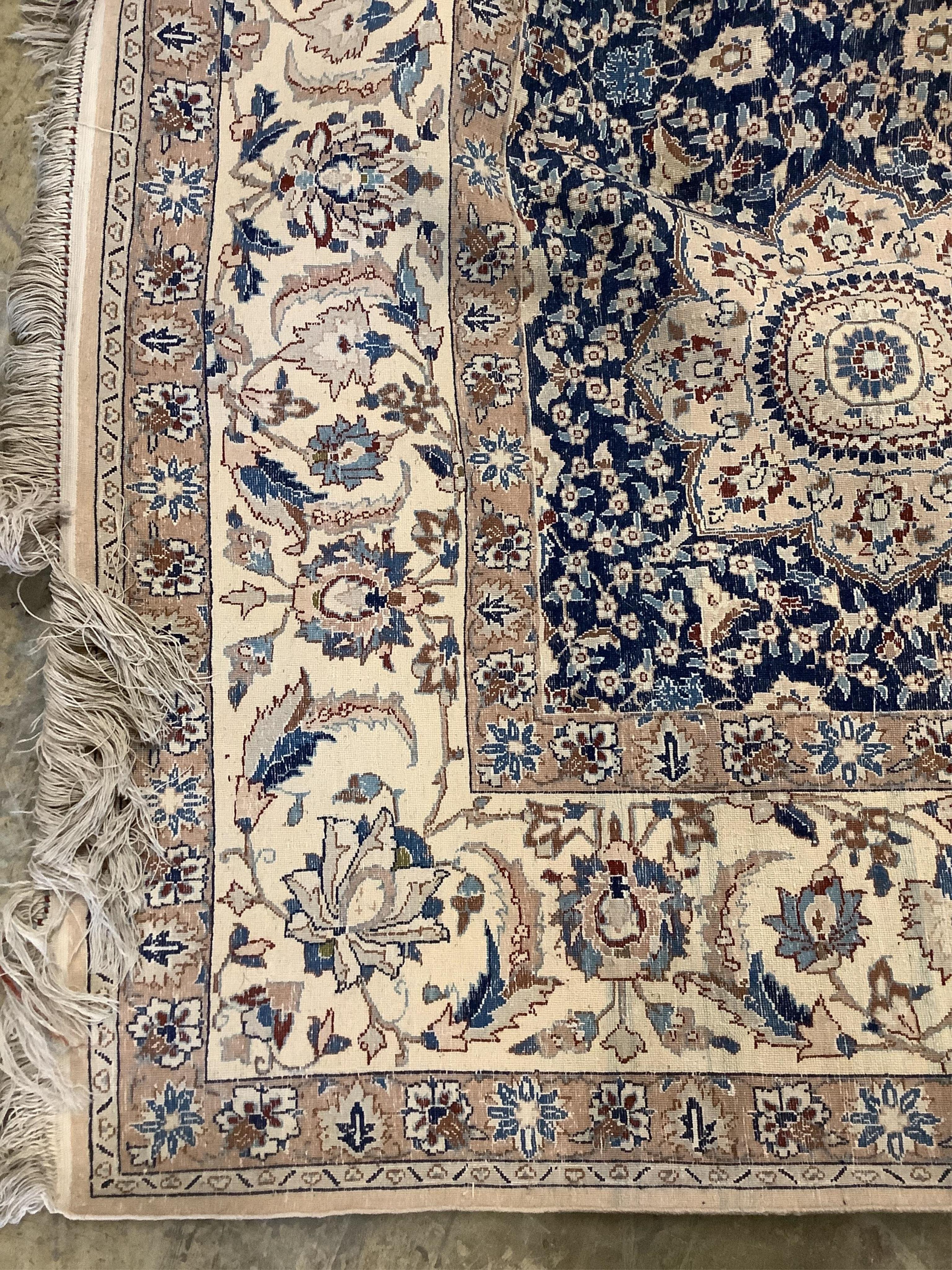 A North West Persian blue and ivory ground carpet with floral borders, 250 x 168cm - Image 2 of 2