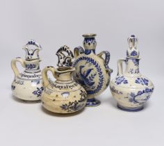 A Delft moonflask and three Delft jugs, largest 22cm
