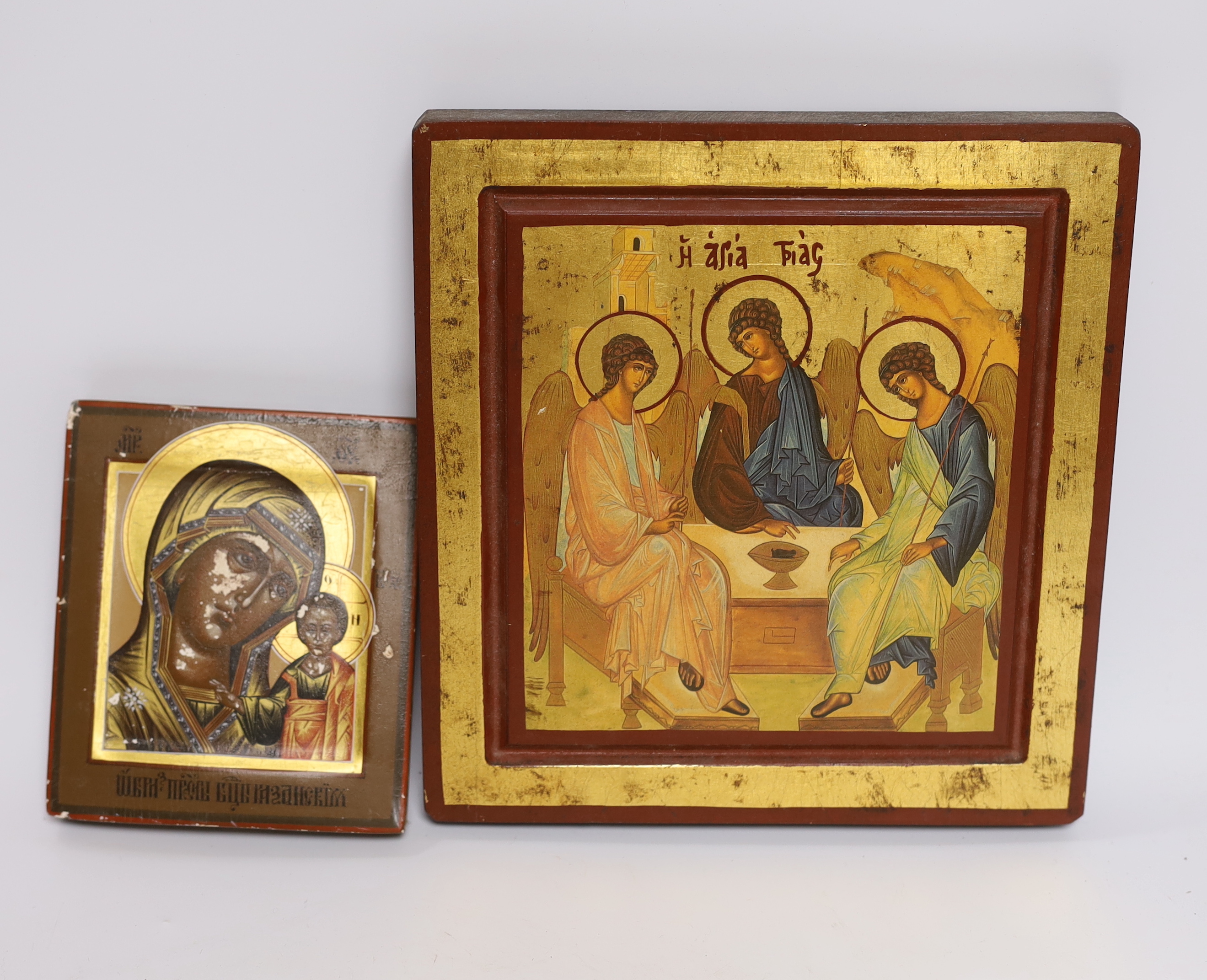 Two modern Russian Icons; the Virgin and child and three angels, larger 22 x 21cm