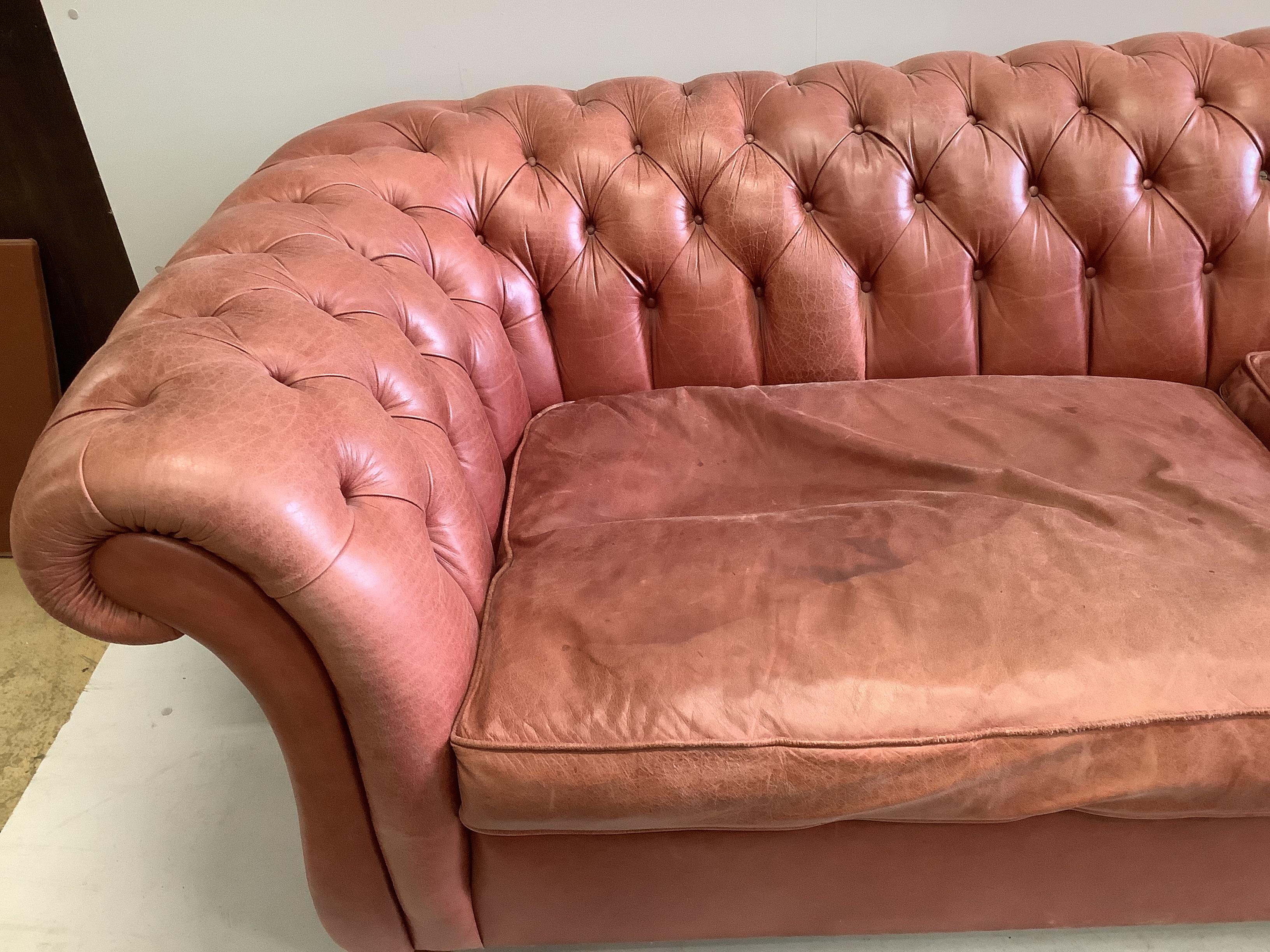 A large Victorian style buttoned back pale red leather Chesterfield settee, width 270cm, depth - Image 2 of 4