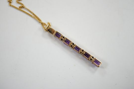 A modern yellow metal, amethyst and diamond chip set line pendant, 47mm, on an 18ct gold fine link - Image 4 of 4