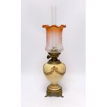 A Royal Worcester blush ivory oil lamp with fluted glass shade, 46cm high