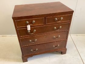 A Georgian style mahogany flush top chest fitted two short and three long drawers, on bracket