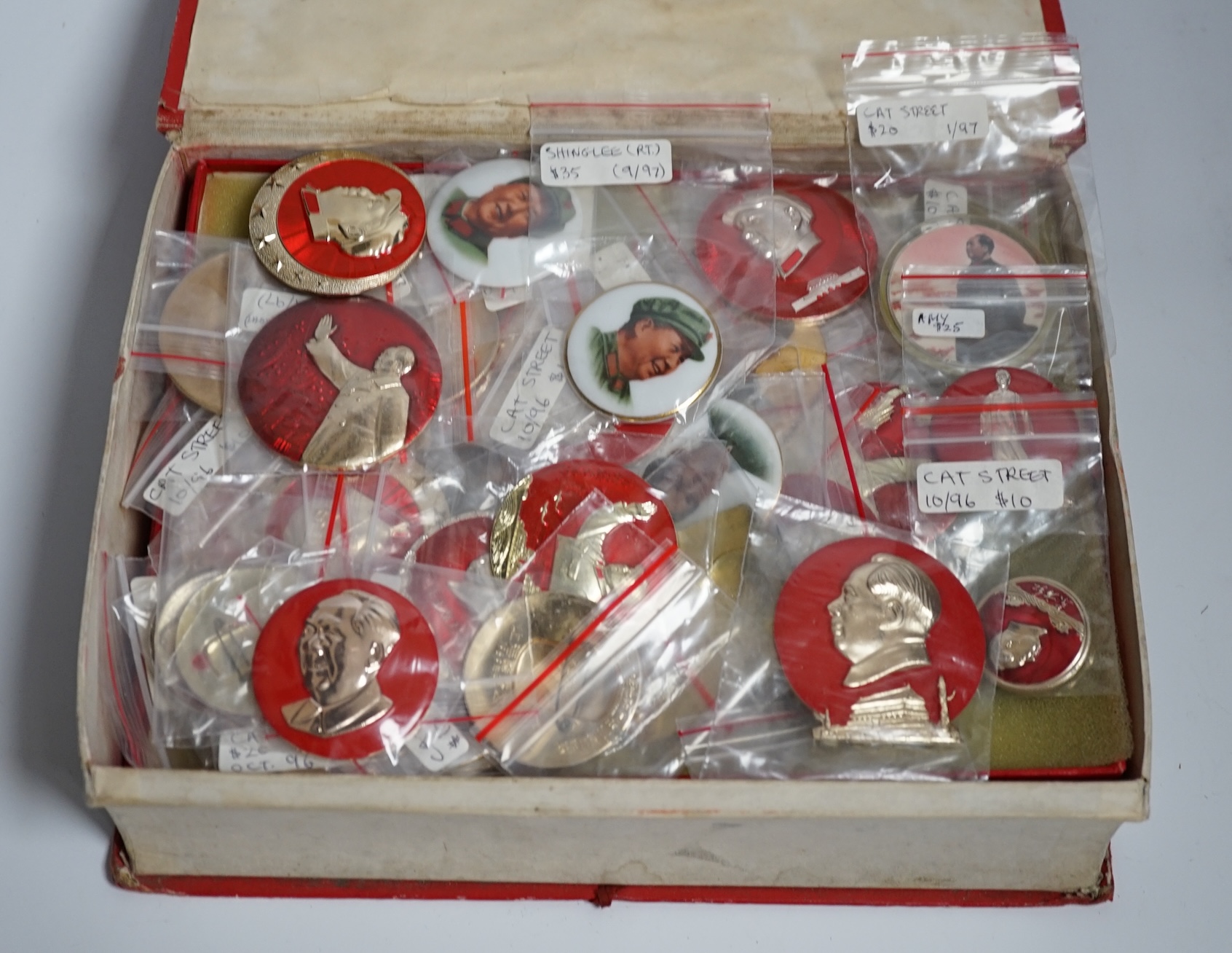 A collection of forty one Chinese Mao Zedong badges and a box