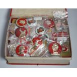 A collection of forty one Chinese Mao Zedong badges and a box