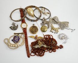 Two wrist watches, assorted badges and costume jewellery including paste set.