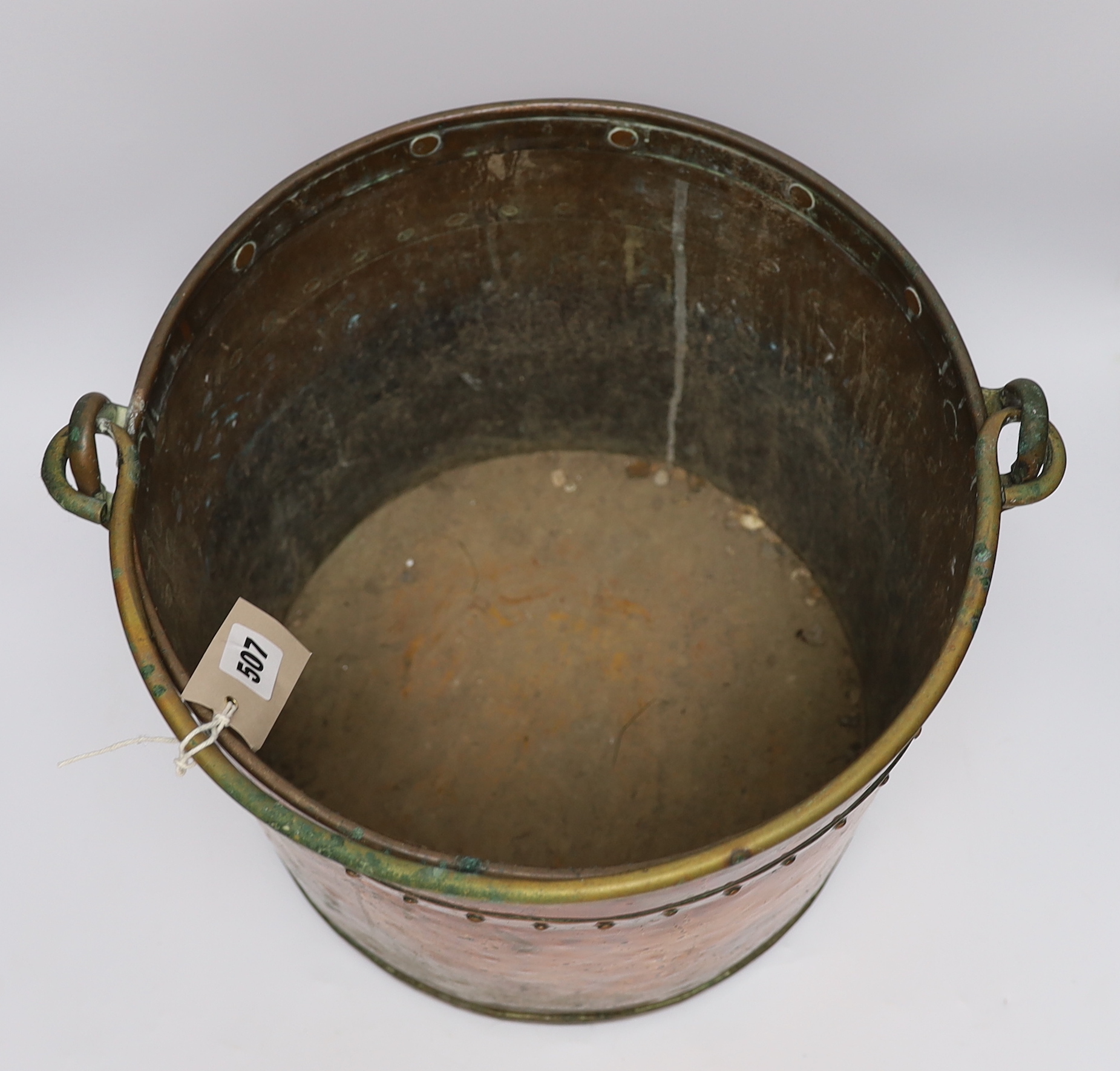 A copper and brass cylindrical log bucket, with swing handle, 33cm high - Image 2 of 2