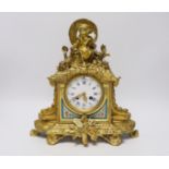 An early 20th century French ormolu mantel clock, with enamel dial, key and pendulum, 31cm