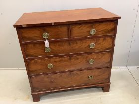 A Georgian mahogany straight front chest of two short and three long drawers, brass ring handles