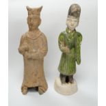 A Chinese grey pottery figure, Han dynasty, and a green glazed figure, Ming dynasty, 23cm