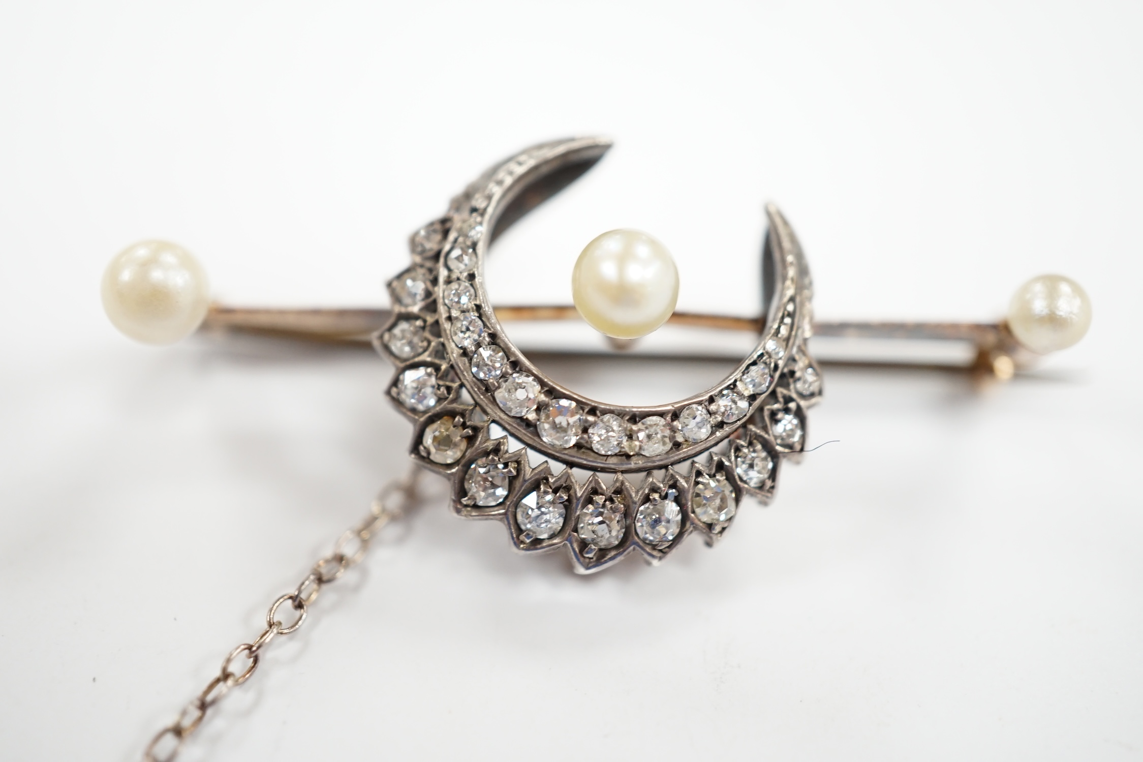 A Victorian yellow and white metal, diamond and pearl set crescent bar brooch, 44mm, gross weight - Image 2 of 3