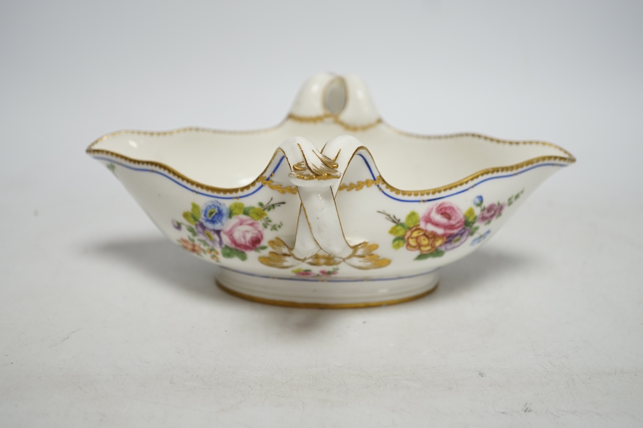 An 18th century Sevres sauceboat, probably later enamelled with flowers, 23.5cm wide - Image 2 of 5