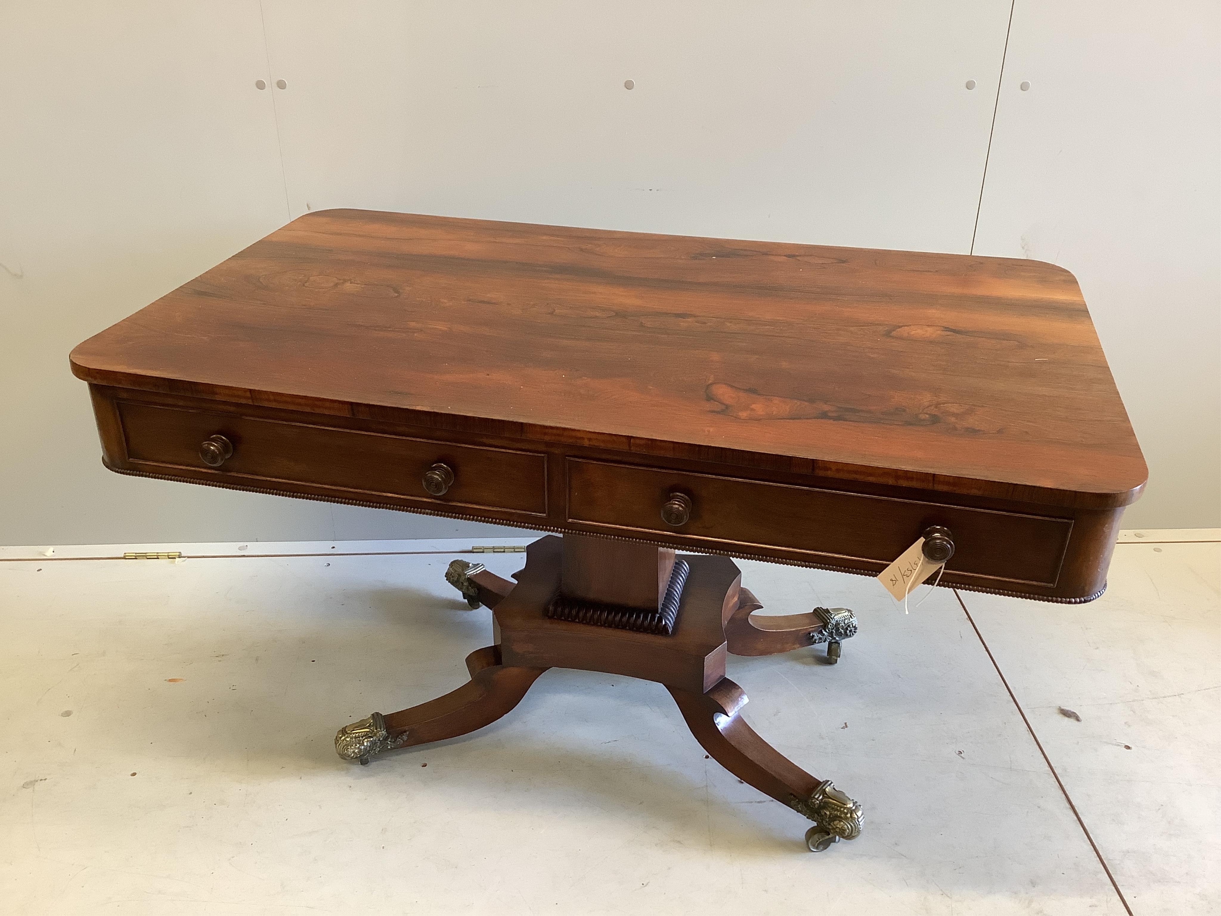 A Regency rectangular rosewood centre / library table, fitted two frieze drawers and two dummy