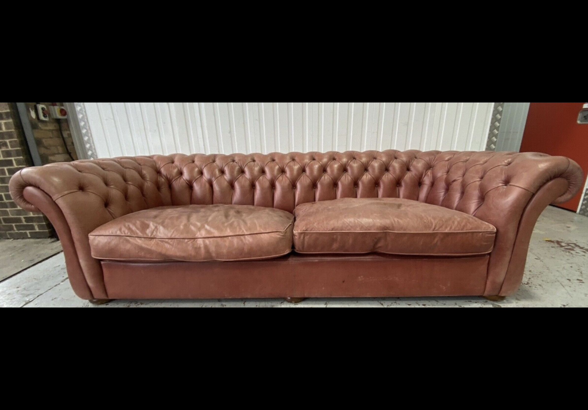 A large Victorian style buttoned back pale red leather Chesterfield settee, width 270cm, depth - Image 4 of 4