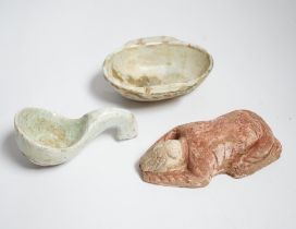 A Chinese glazed pottery ‘ear’ cup and similar spoon, Han dynasty, and a pottery figure, Song