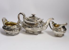 A George IV silver three piece oval tea set, on winged paw feet, by Naphtali Hart, London 1820,
