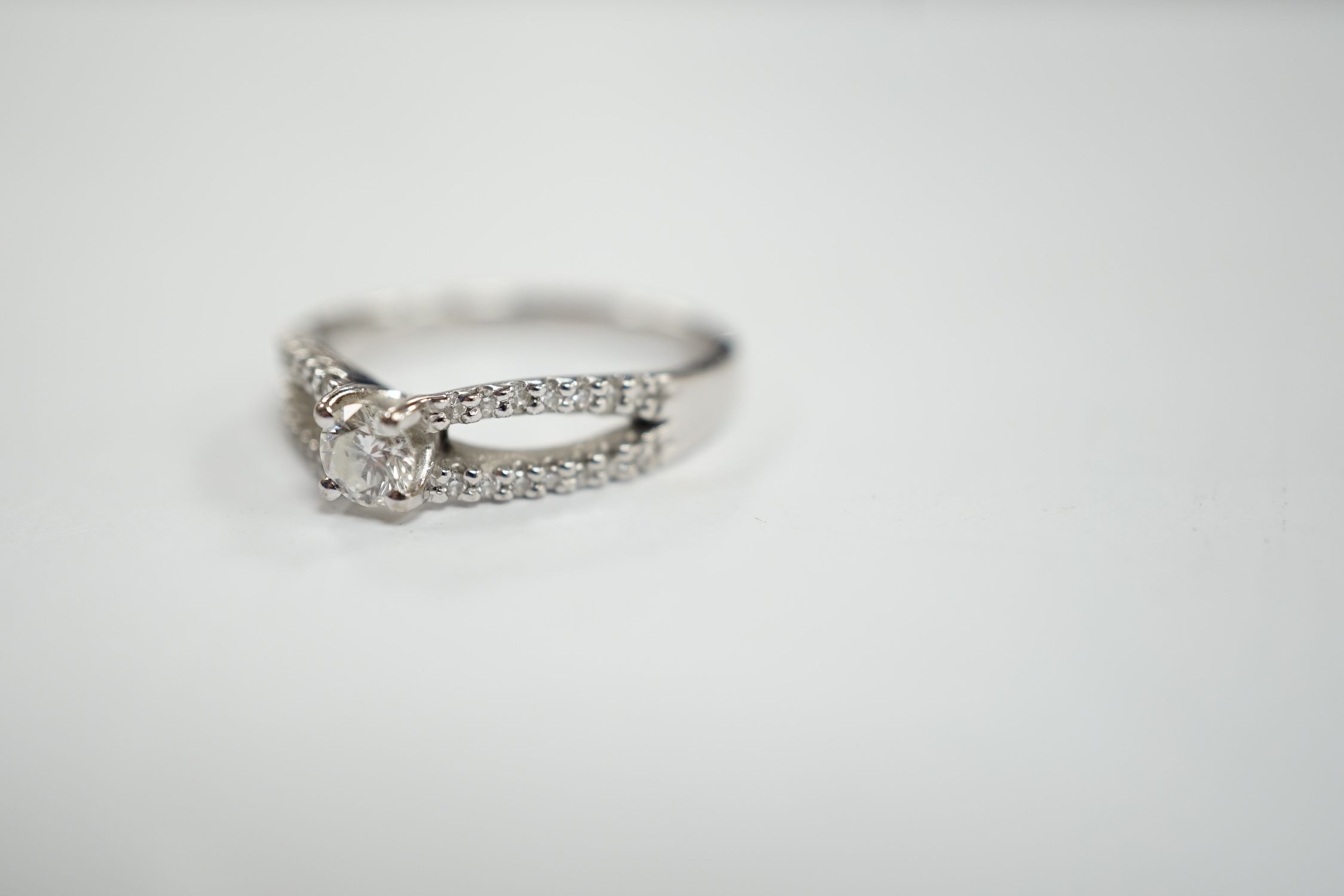 A modern 18ct white gold and single stone diamond set ring, with diamond chip set split shoulders, - Image 2 of 4