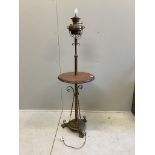 A late Victorian brass and oak telescopic oil lamp standard, converted to electricity, height 152cm