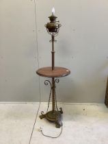 A late Victorian brass and oak telescopic oil lamp standard, converted to electricity, height 152cm
