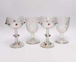 A pair of unusual Bohemian wheel engraved glass roemers with applied red and green glass prunts,