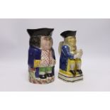 A pearlware Toby jug, c.1795 and late 19th century Staffordshire Toby jug, tallest 19cm