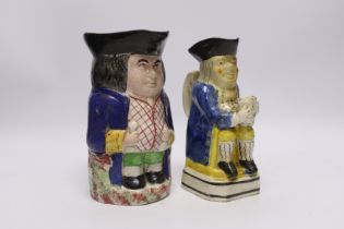 A pearlware Toby jug, c.1795 and late 19th century Staffordshire Toby jug, tallest 19cm