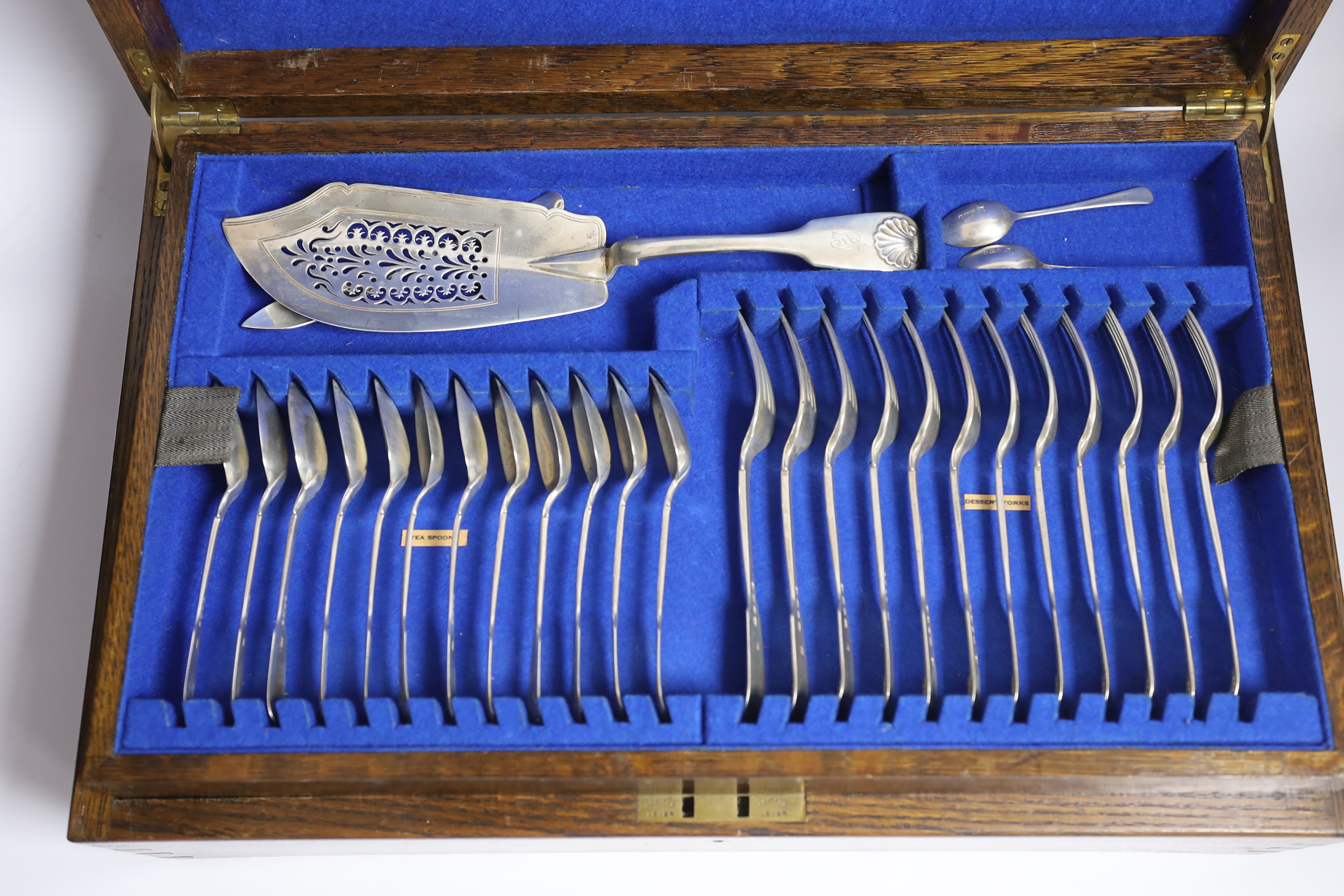 A Victorian oak cased matched canteen of silver fiddle and shell pattern flatware, by John & Henry - Image 2 of 10