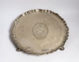 A large George II silver shaped circular salver, with pie crust border and engraved armorial, on