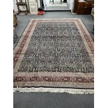 A Turkish Hereke blue ground carpet, 425 x 294cm