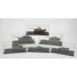 Sixty-eight magazine issue military vehicles in plastic display cases, including; tanks, armoured