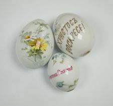 Three Russian porcelain Easter eggs, 19th century, 11cm in length