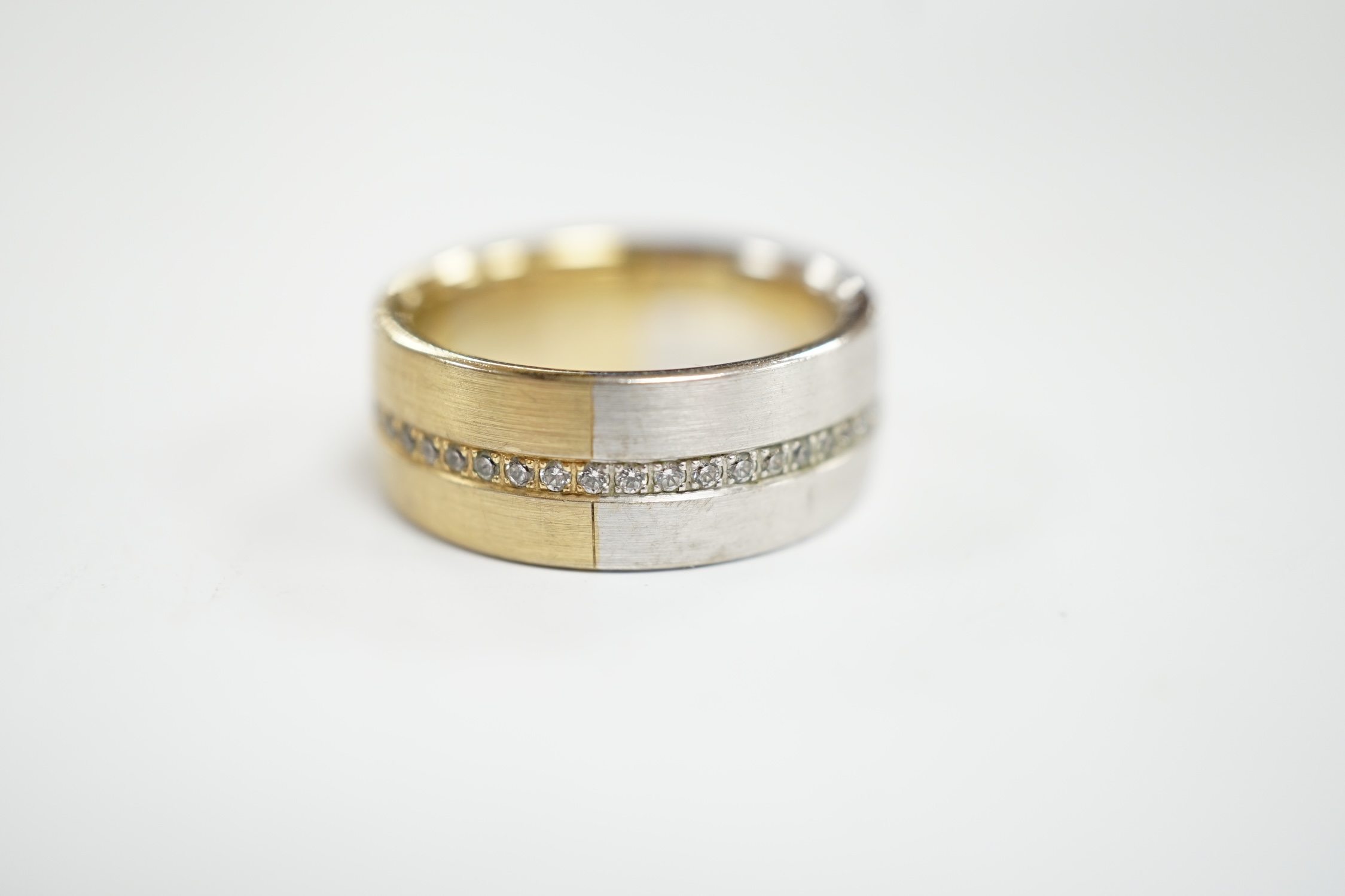 A two colour base metal band, with central row of simulated diamonds, size O. - Image 2 of 4