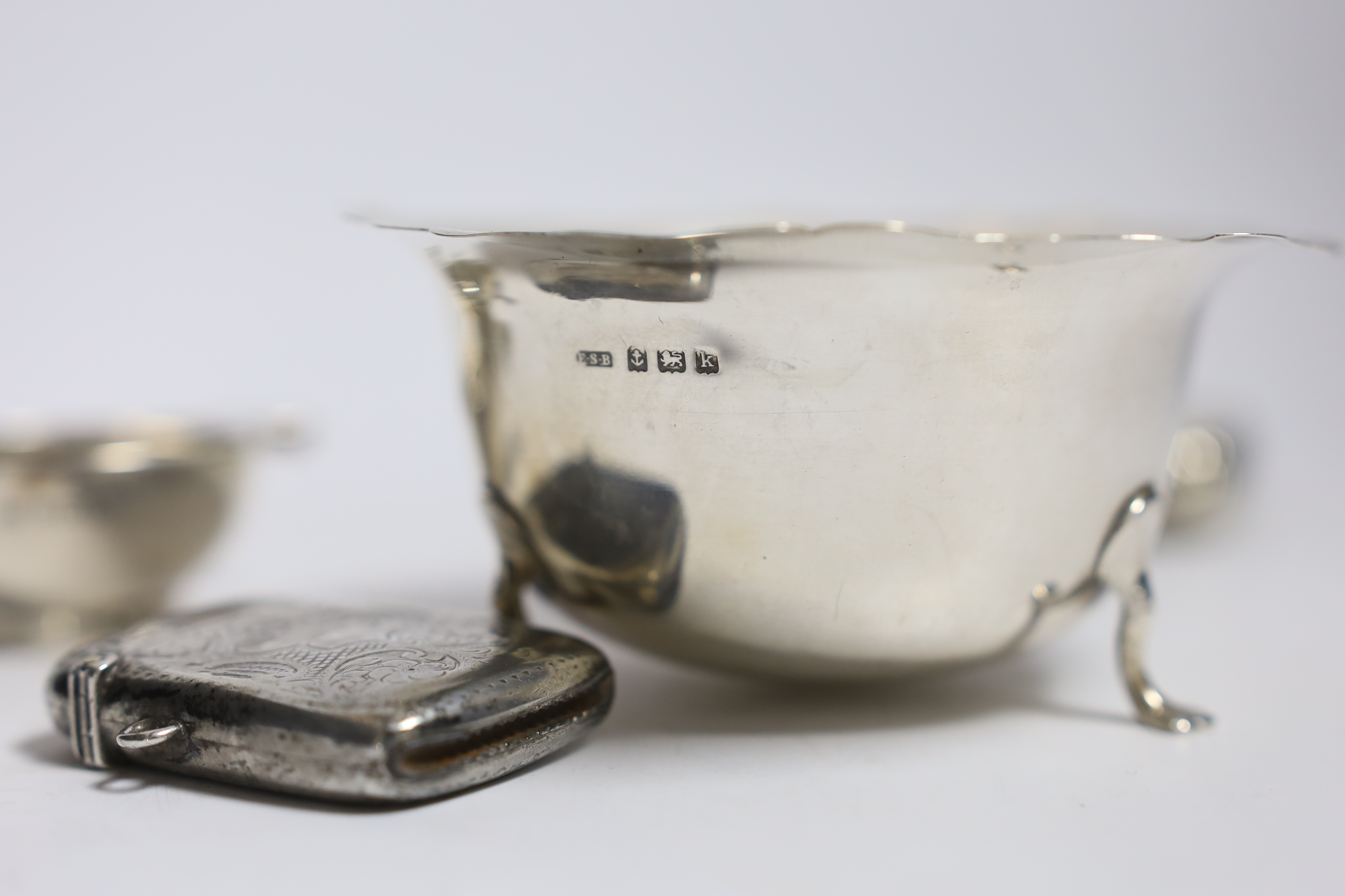 A silver cigarette case, small silver quaich, silver bowl and silver matchbox sleeve. - Image 4 of 4