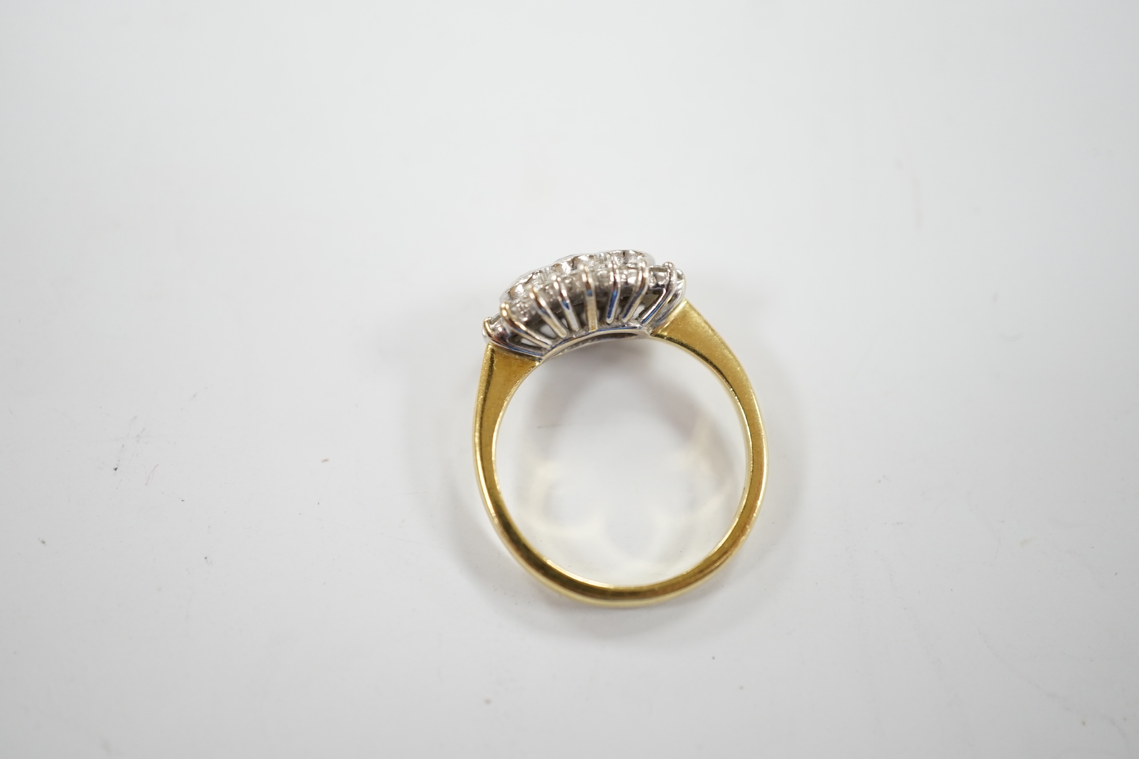 A modern 18ct gold and collet set three stone diamond ring, with diamond chip set border, size J/ - Image 4 of 4