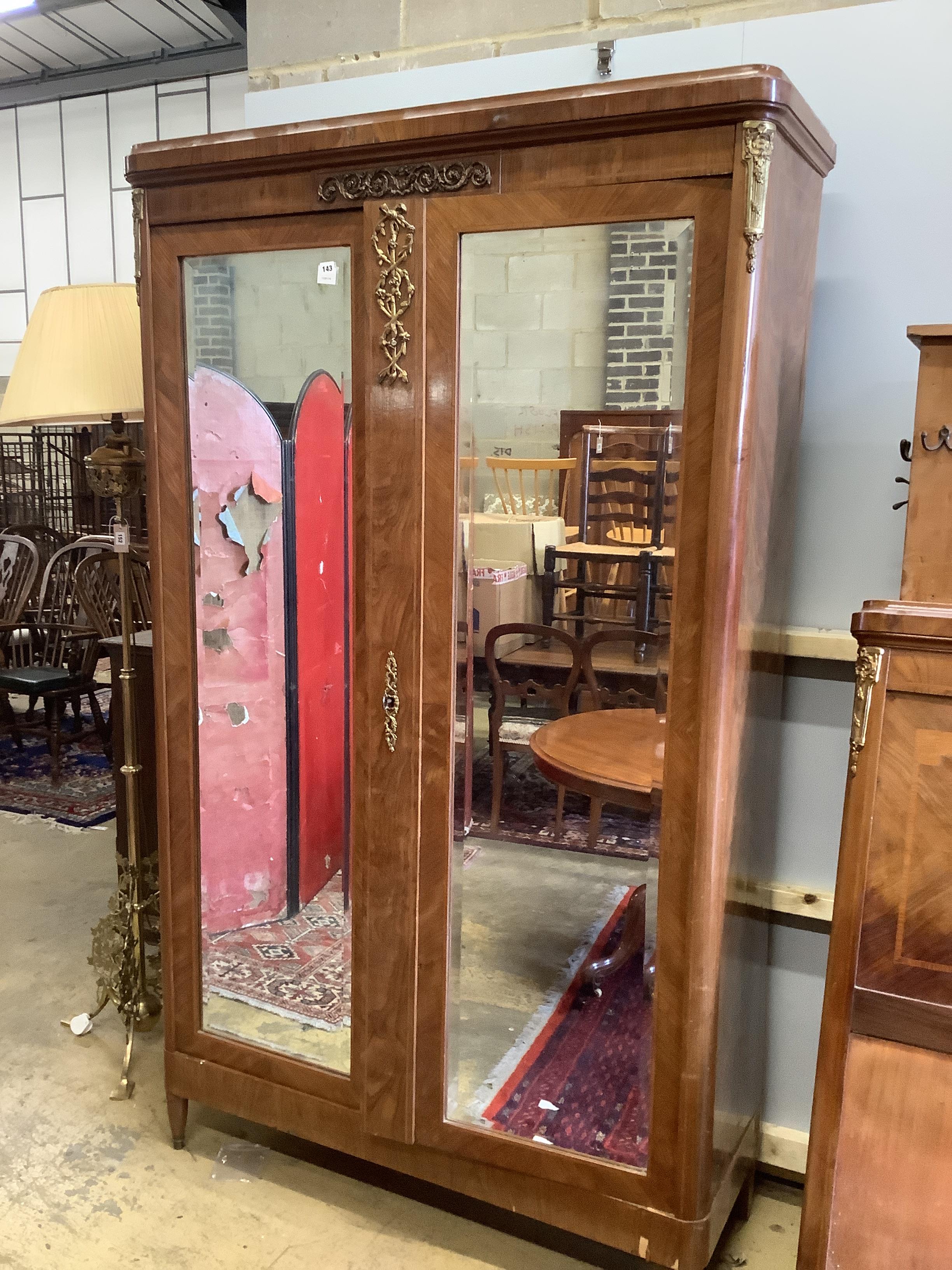 An early 20th century French gilt metal mounted kingwood mirrored armoire, width 120cm, depth