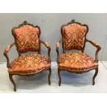 A pair of early 20th century French walnut upholstered open armchairs, width 63cm, depth 53cm,