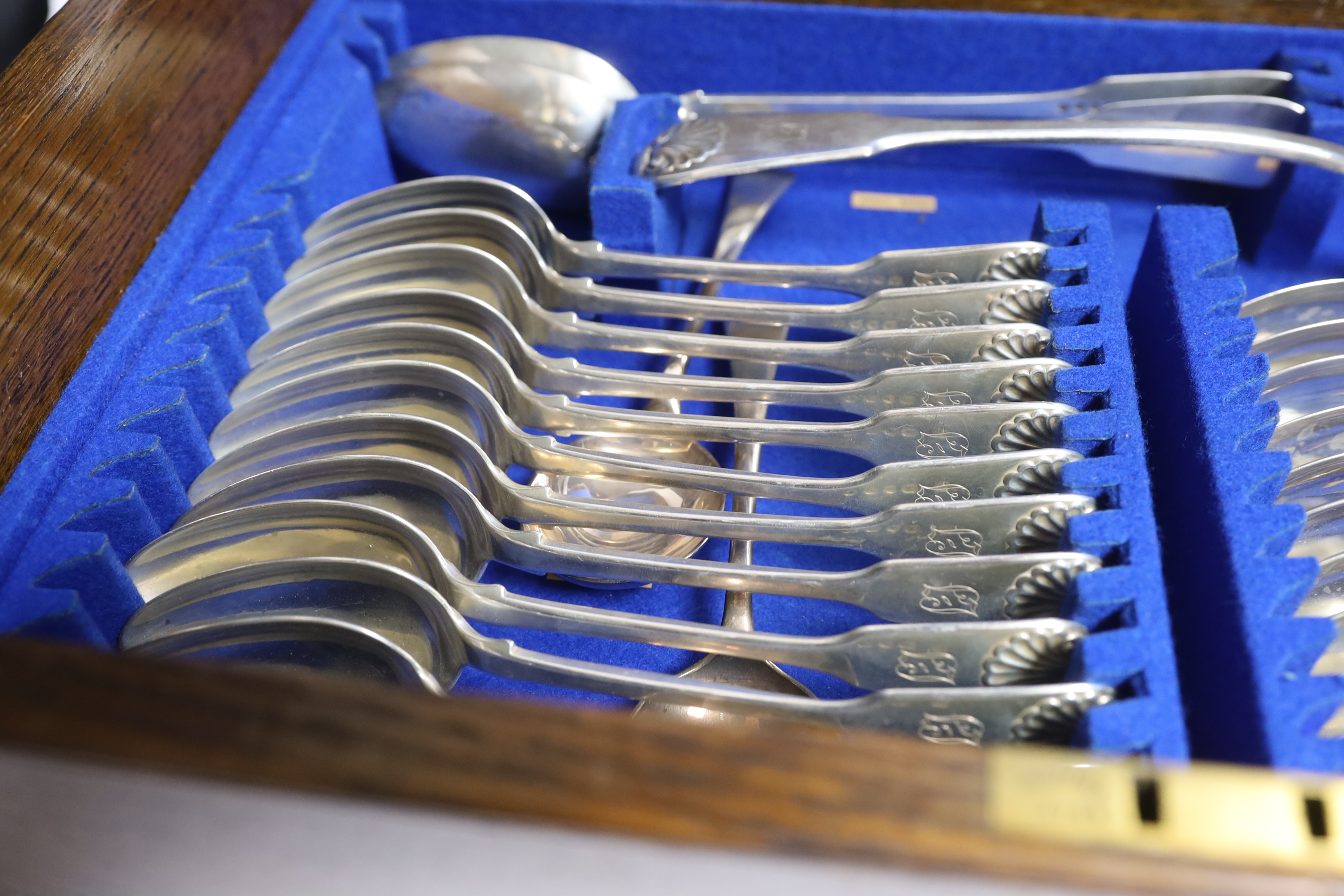 A Victorian oak cased matched canteen of silver fiddle and shell pattern flatware, by John & Henry - Image 9 of 10