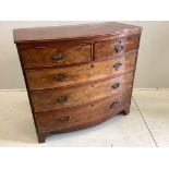 A Regency mahogany bow front chest of two short and three long drawers, raised on bracket