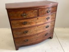A Regency mahogany bow front chest of two short and three long drawers, raised on bracket