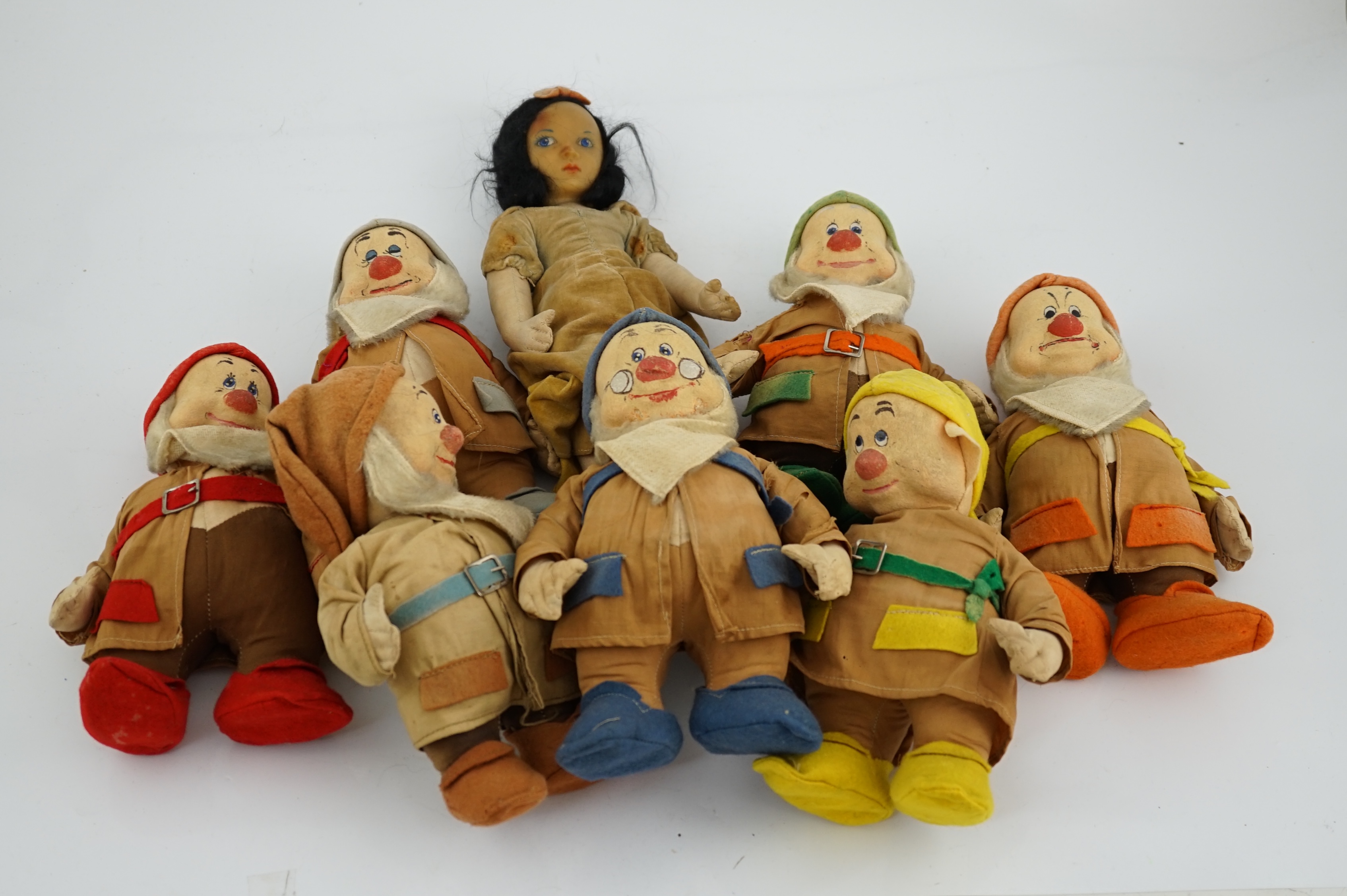 A set of Merrythought Snow White and the Seven Dwarves, Snow White with Merrythought label to the