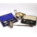 A small group of silver items to include a George V sauceboat, London, 1934, a George III toddy