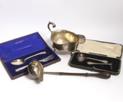 A small group of silver items to include a George V sauceboat, London, 1934, a George III toddy