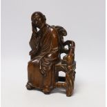 A Chinese carved wood figure of a scholar, 19cm