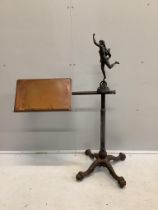 A Victorian oak and cast iron adjustable reading table, height 114cm