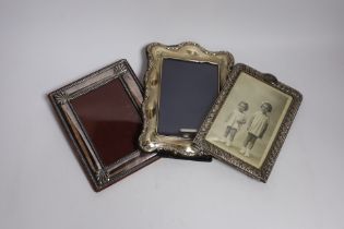 A late Victorian repousse silver mounted photograph frame, Birmingham, 1898, 17.3cm, together with a