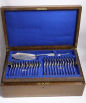 A Victorian oak cased matched canteen of silver fiddle and shell pattern flatware, by John & Henry