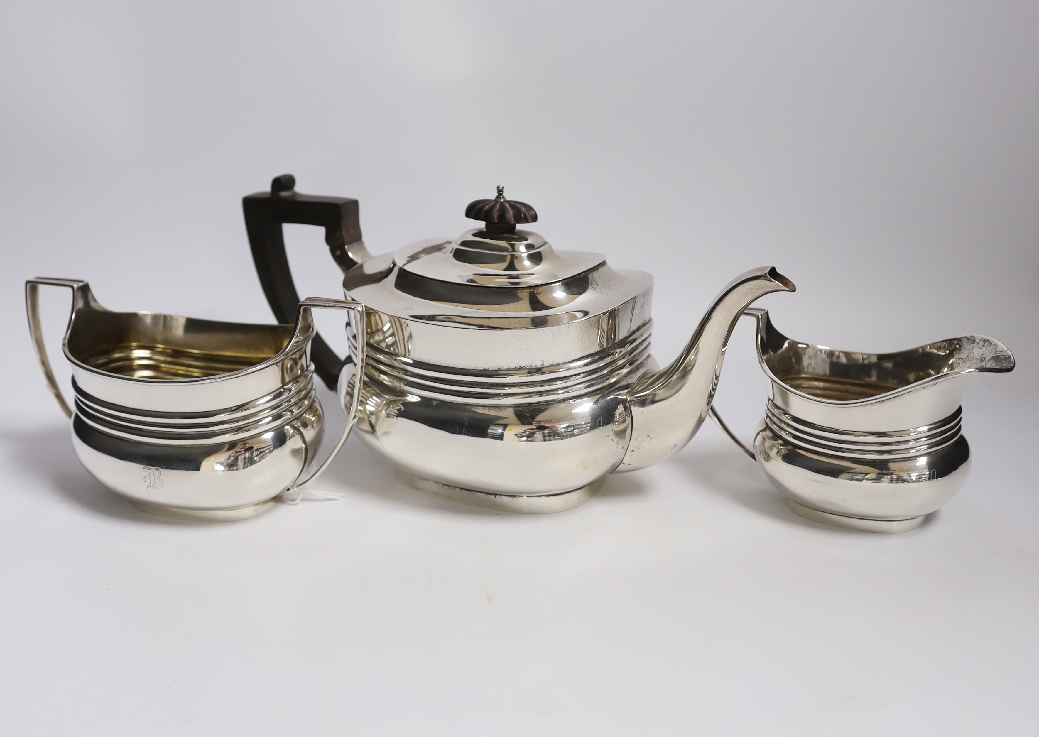 An early 20th century three piece silver tea set, by William Barnard & Sons Ltd, London, 1908/11,