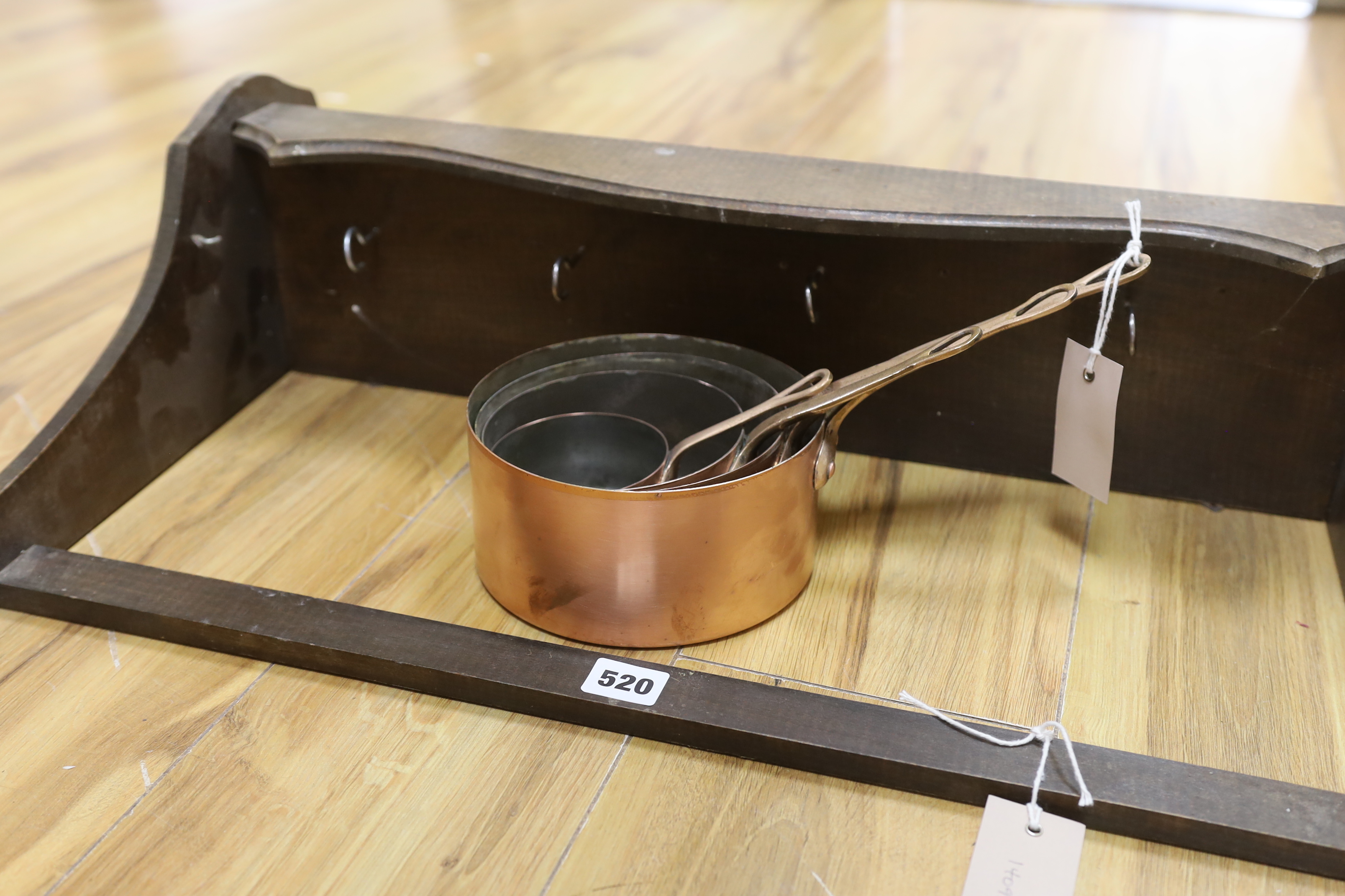 A graduated set of four copper and brass handled saucepans with a beech hanging wall rack, rack - Image 3 of 3