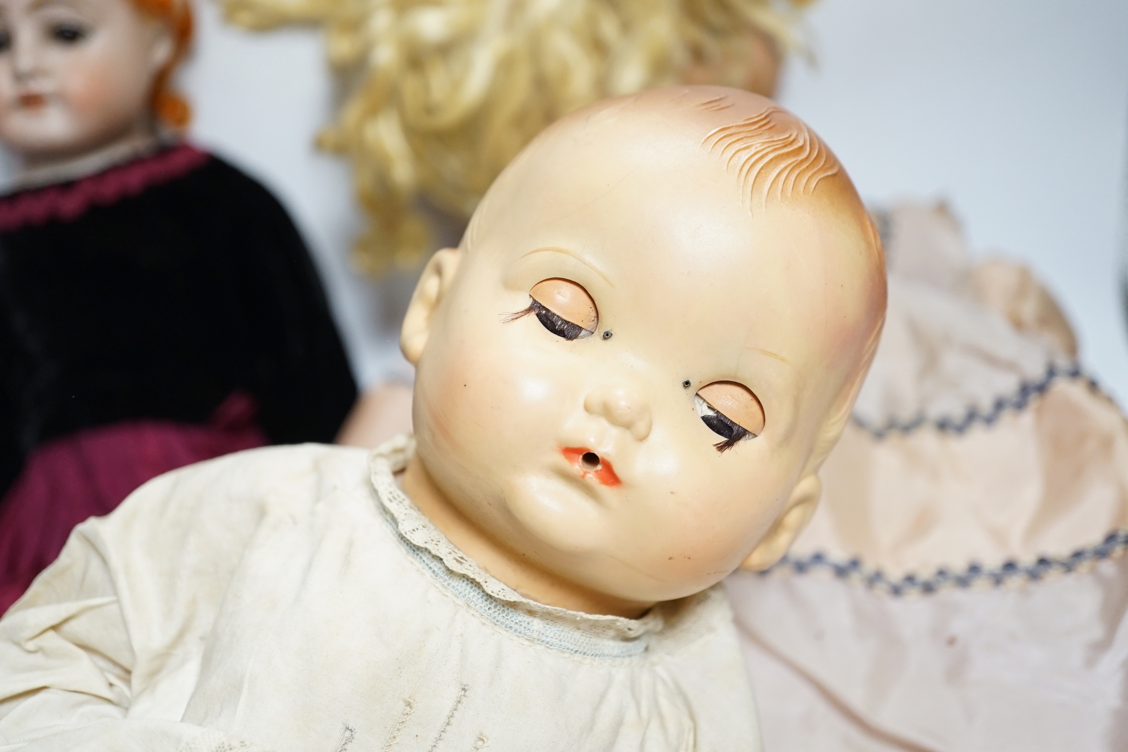 Three dolls; a German Bisque shoulder head doll with sleeping eyes with jointed kid leather body, - Bild 3 aus 4