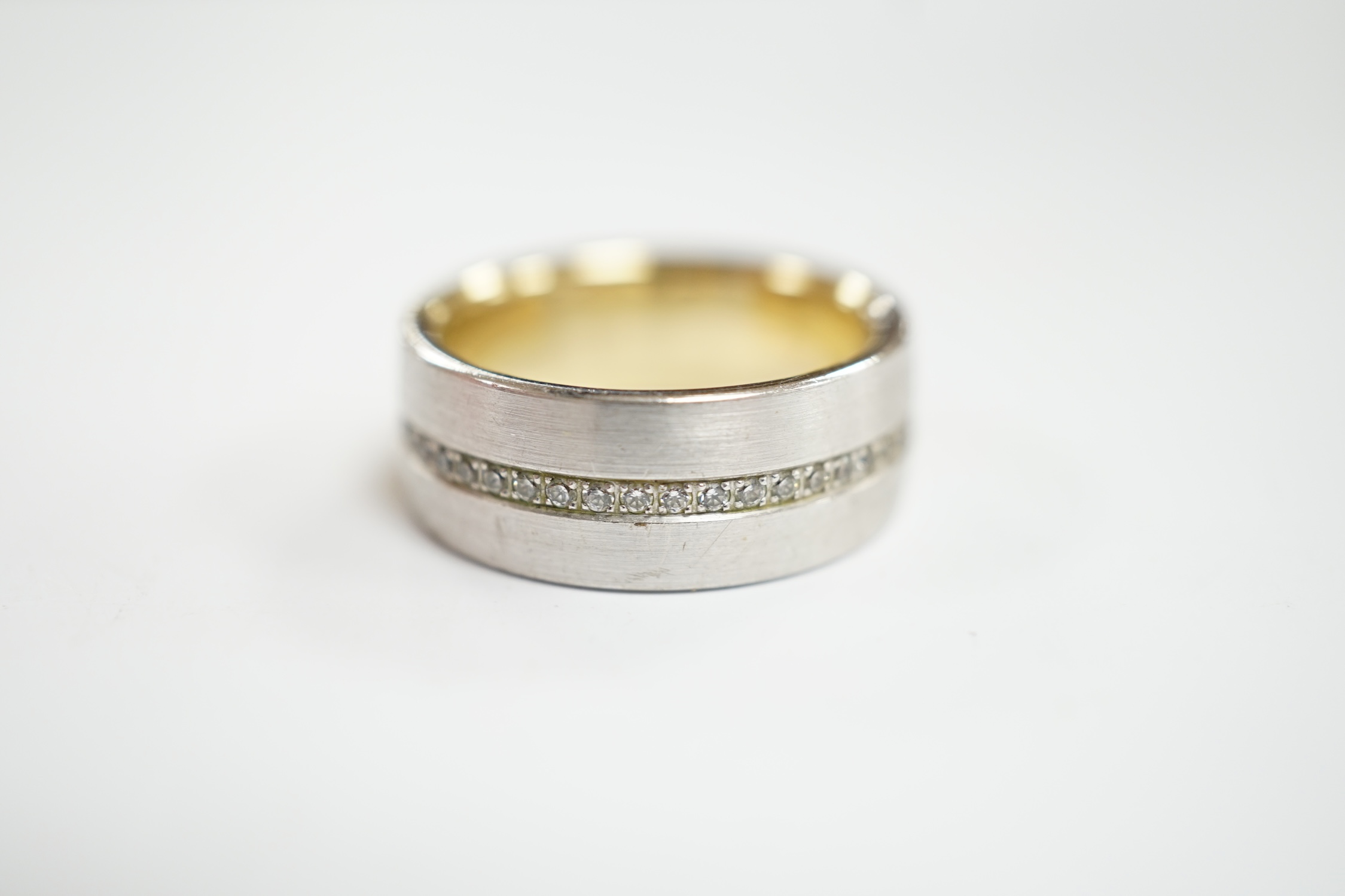 A two colour base metal band, with central row of simulated diamonds, size O. - Image 3 of 4